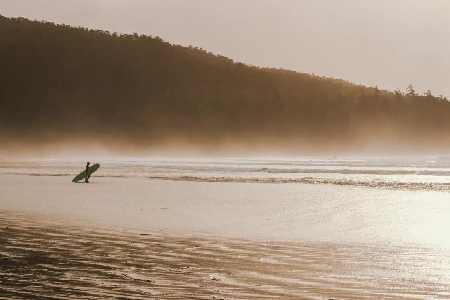 surfer at sunset. Credit: Surfline Canada