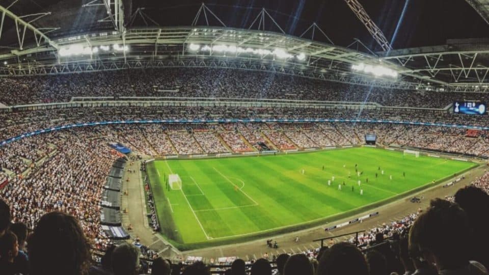 A football stadium with fans at dawn during the 2022 Qatar World Cup