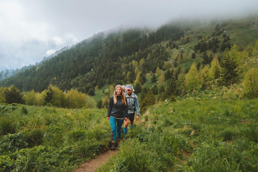 two hikers in nature; sustainable tourism