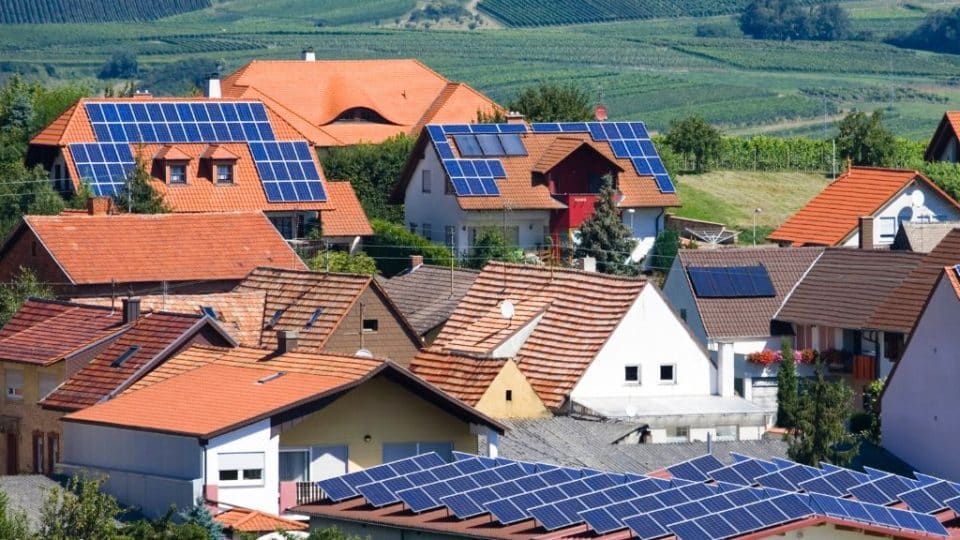 Solar panels on the rooftops of houses in a European town