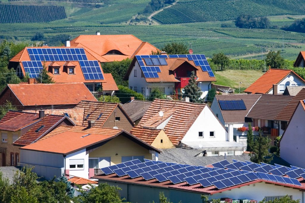 Solar panels on the rooftops of houses in a European town