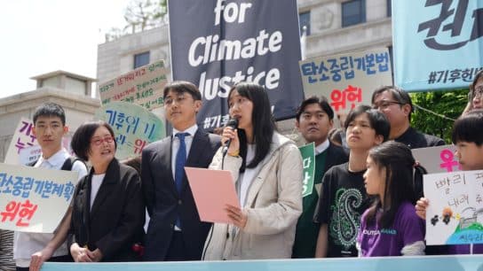 Plaintiff speaking at a press conference ahead of the first public hearing held on April 23, 2024.