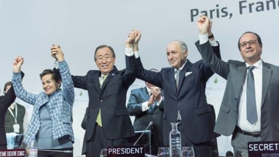 Secretary-General Ban Ki-moon (second left); Christiana Figueres (left), Executive Secretary of the UN Framework Convention on Climate Change (UNFCCC); Laurent Fabius (second right), Minister for Foreign Affairs of France and President of the UN Climate Change Conference in Paris (COP21) and François Hollande (right), President of France celebrate after the historic adoption of Paris Agreement on climate change.
