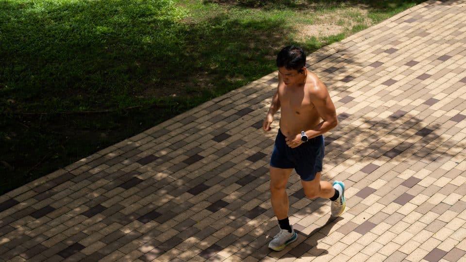 A runner sweating in Hong Kong's heat.