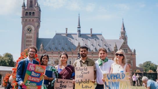 Members of the Pacific Islands Students Fighting Climate Change stand in front of the Peace Palace in The Hague ahead of the court's delivery of its advisory opinion on climate change on July 23, 2025.