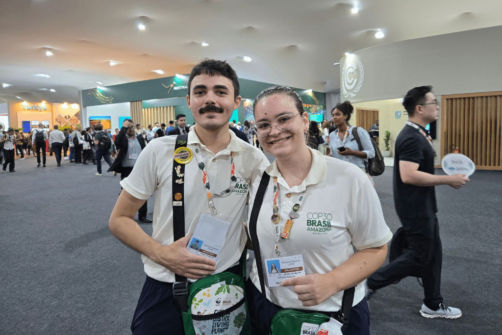 Pedro and Nathalia are among the more than 1,900 local volunteers at the COP30 summit in Belém, Brazil.