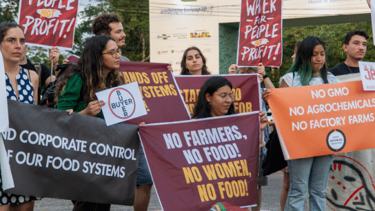 Climate campaigners confront Big Agriculture lobbyists in a protest at the COP30 “AgriZone” on November 10, 2025.