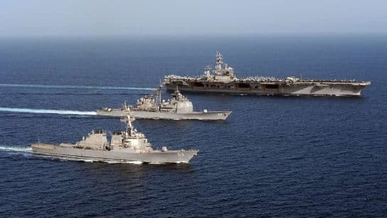 US Navy ships in formation in the Arabian Sea.