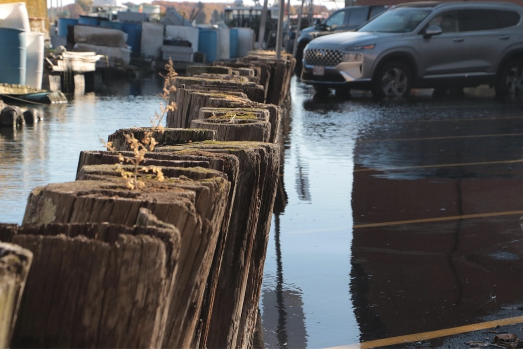 Downtown Portland, ME’s Commercial Street flooded after a series of winter storms in 2023.