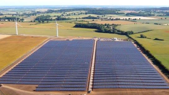 Aerial view of Westmill Solar Farm with part of Westmill Wind Farm in the background.