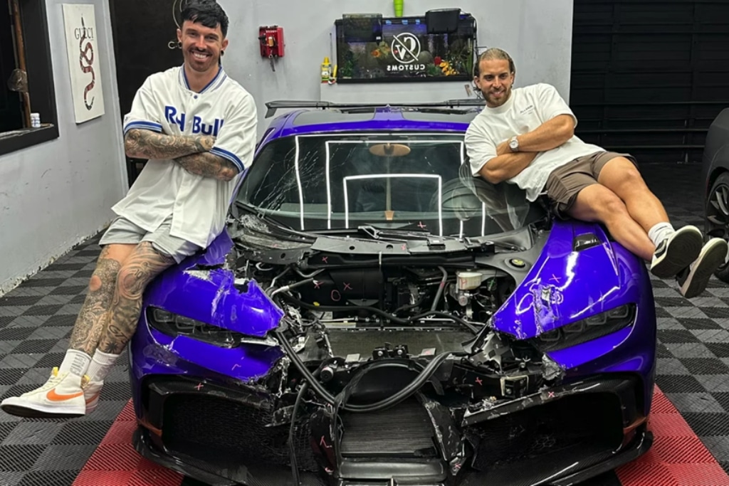 Mat Armstrong and Alex Gonzalez pictured on the wrecked Bugatti Chiron Pur Sport.